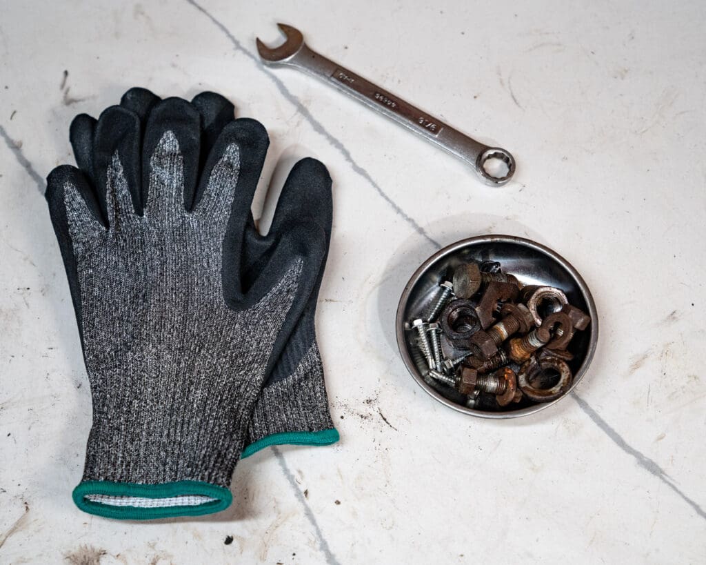 503 PPE cut resistant gloves ANSI A4 on a white background with a wrench to the top right